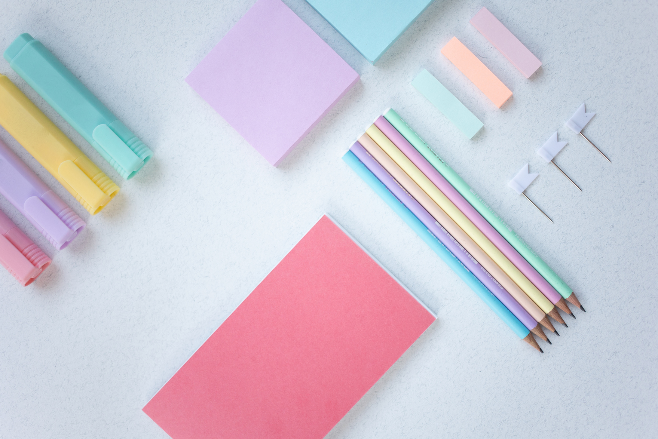 Organized Stationery Items on White Surface